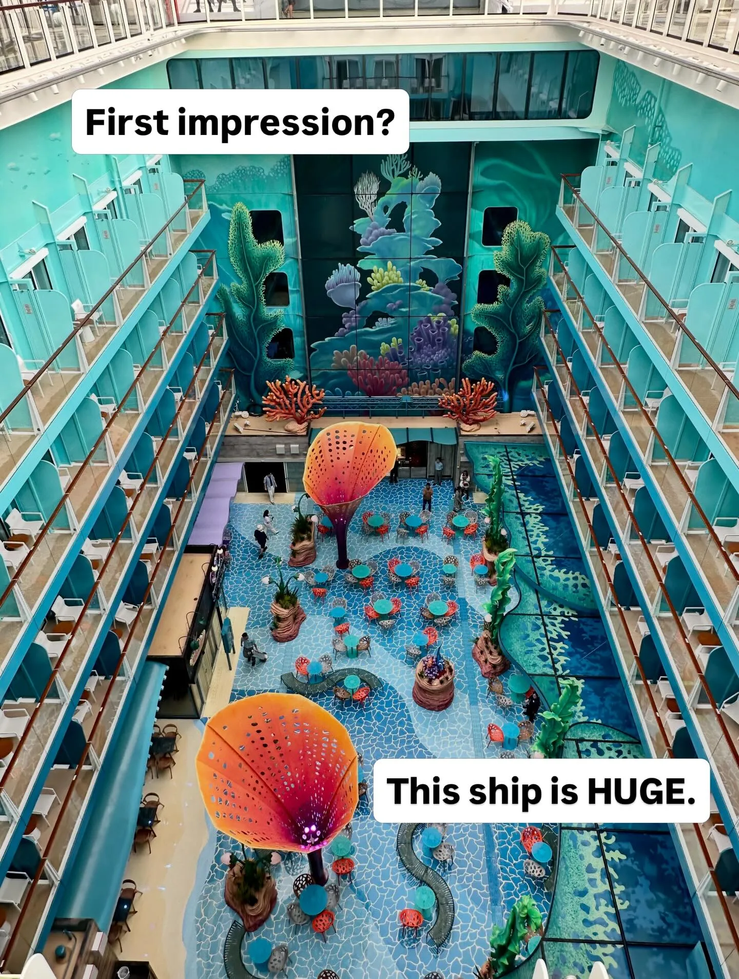Disney Discovery Reef atrium aerial view showing underwater themed decor with coral sculptures and multi-level balconies on Disney Adventure