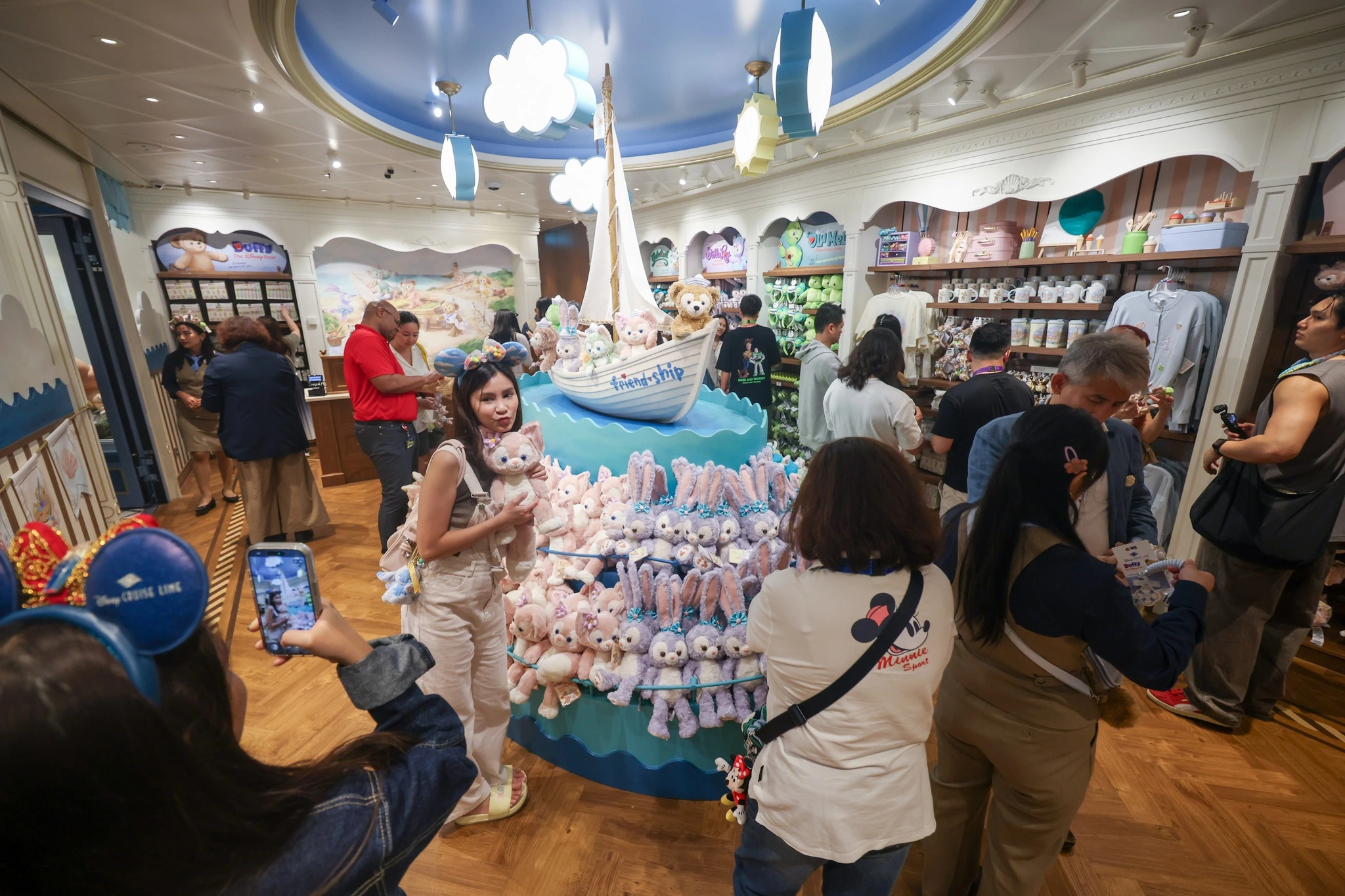 Duffy and Friends shop on Disney Adventure with Friendship sailboat display LinaBell StellaLou plush toys and guests shopping