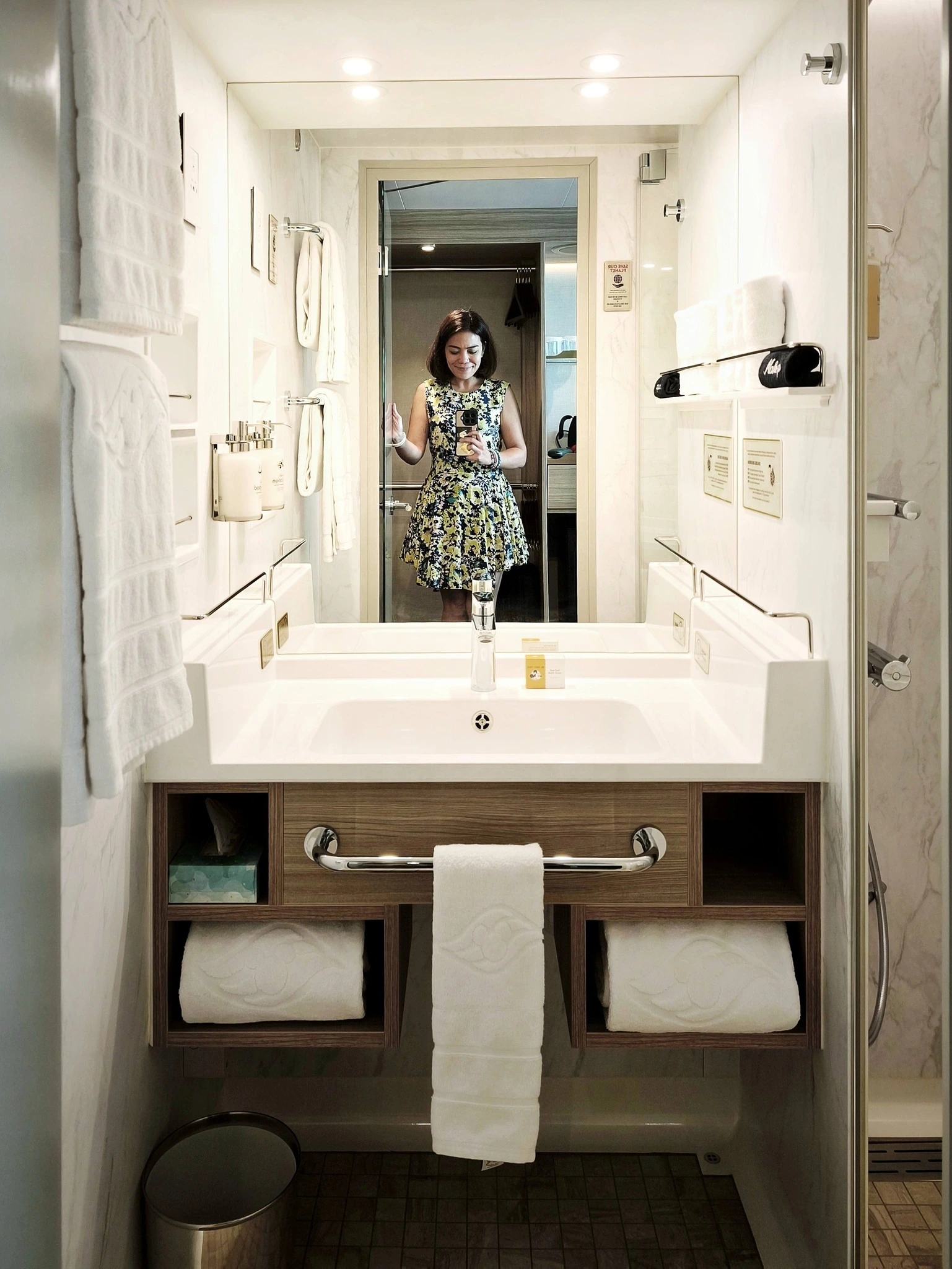 Disney Adventure stateroom bathroom with marble finish large mirror vanity and premium spa toiletries