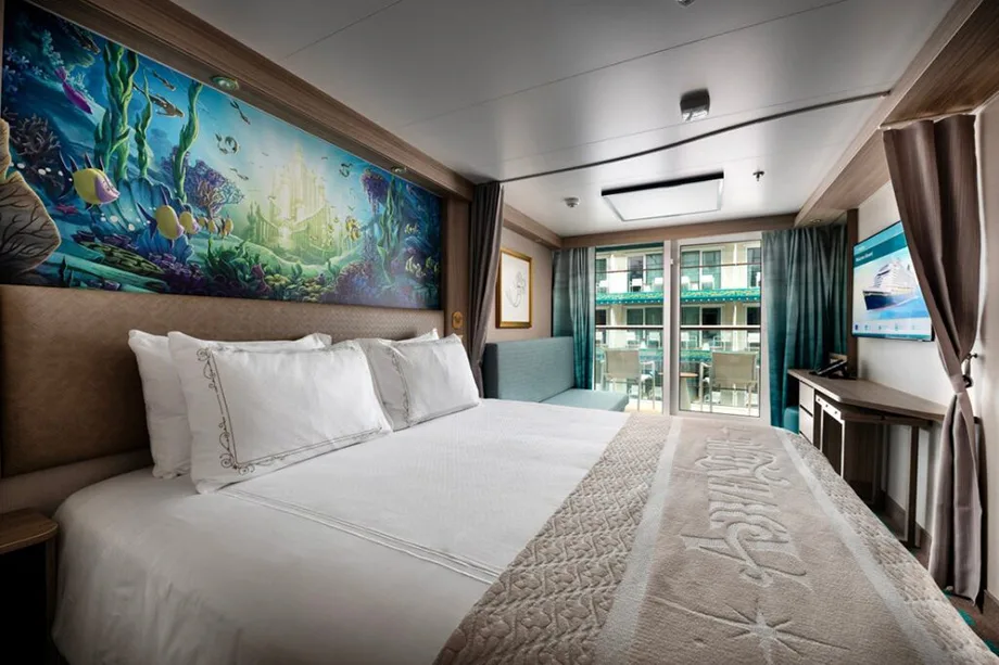 Garden View with Verandah stateroom on the Disney Adventure — queen bed, underwater artwork, and Imagination Garden balcony