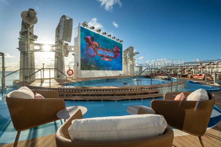 Wayfinder Bay Moana-themed pool on the Disney Adventure — ocean-view deck with LED screen and plush loungers